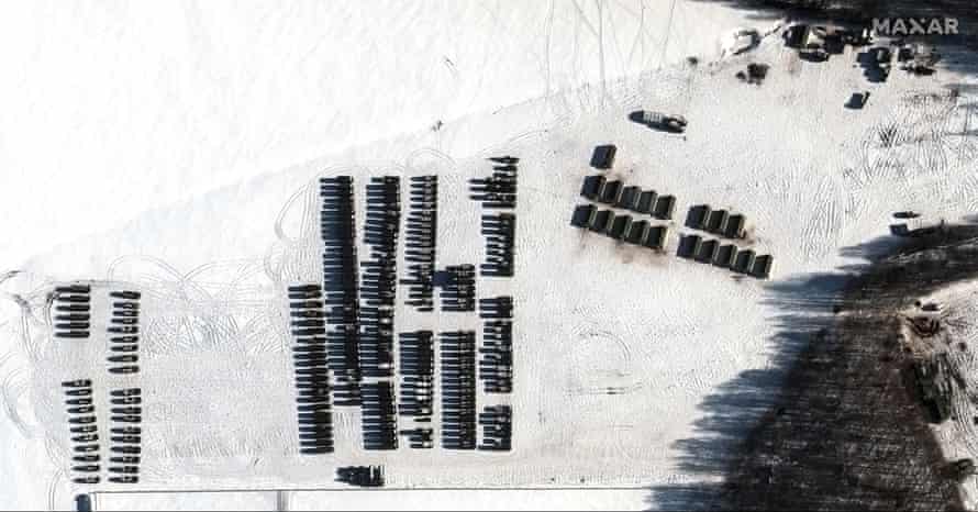 This satellite image provided by Maxar Technologies shows troops and logistics material support units, near Yelsk, Belarus.