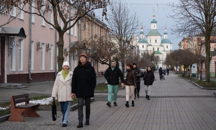 People walk down a pedestrian street in Sumy on New Year’s Day.