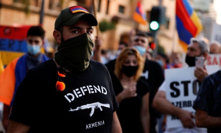 Members of the Armenian Youth Federation protest outside the Azerbaijan consulate general office in Los Angeles.