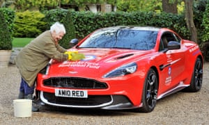 Dame Judi Dench washing an Aston Martin
