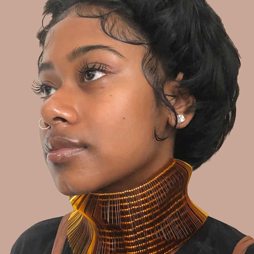 A woman wearing a reversable upcycled collier