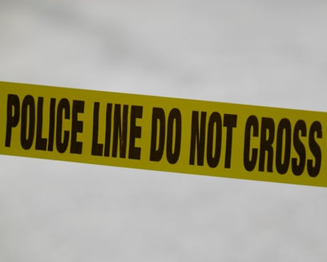 Yellow police tape saying 'police line do not cross'