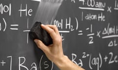 hand erasing equations on a blackboard.