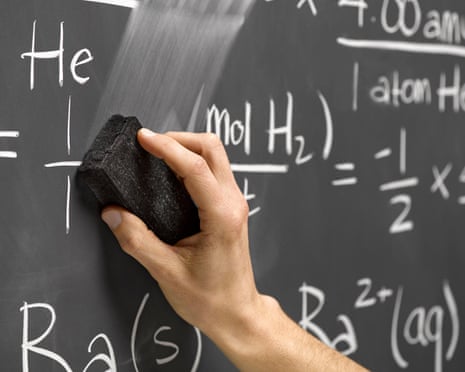 hand erasing equations on a blackboard.