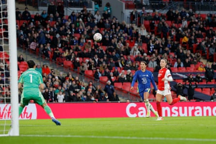 Sam Kerr dinks a delightful third Chelsea goal over the Arsenal goalkeeper Manuela Zinsberger.