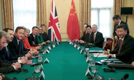 Xi Jinping meets David Cameron and other senior members of his government in the cabinet room at 10 Downing Street.