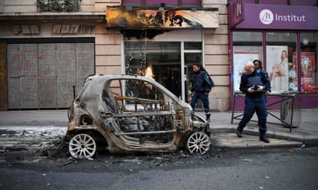 A burned out car in Paris on Sunday