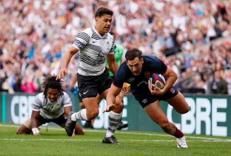Jonny May of England breaks to score his team's first try during the Summer International match between England and Fiji at Twickenham.