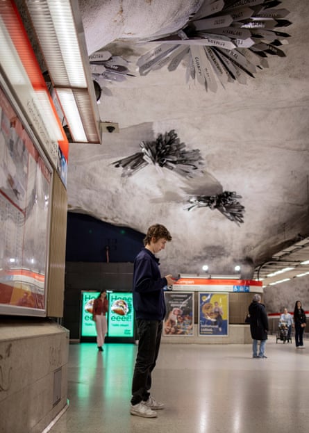 People standing in the Kamppi metro station in Helsinki.