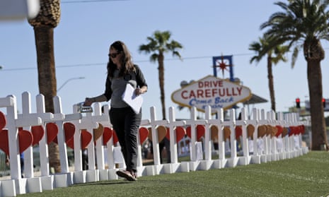Sherri Camperchioli helps set up some of the crosses that arrived in Las Vegas today to honor the victims of the mass shooting on Thursday, Oct. 5, 2017, in Las Vegas. A gunman opened fire on an outdoor music concert on Sunday killing dozens and injuring hundreds. (AP Photo/Gregory Bull)