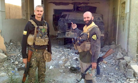 Oliver Hall pictured with a fellow YPG fighter