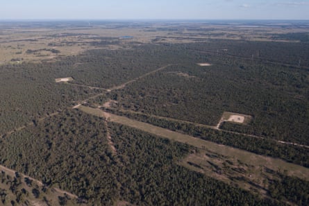Aerial view of gas wells amid vegetation