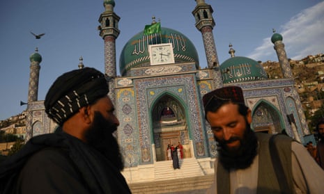 Taliban stand guard in front of the the Sakhi Shah-e Mardan Shrine and mosque in Kabul. The shrine is visited mainly by Hazaras.