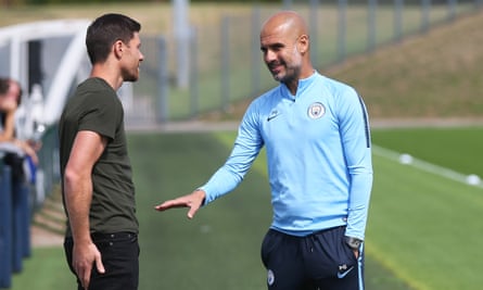 Pep Guardiola shares a joke with Xabi Alonso after the former Liverpool midfielder dropped by Manchester City’s training ground.