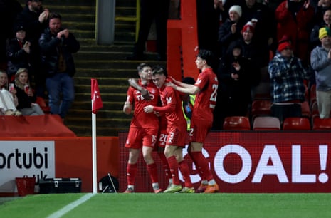 Kevin Nisbet (left) celebrates with teammates after scoring Aberdeen's equaliser against Celtic.