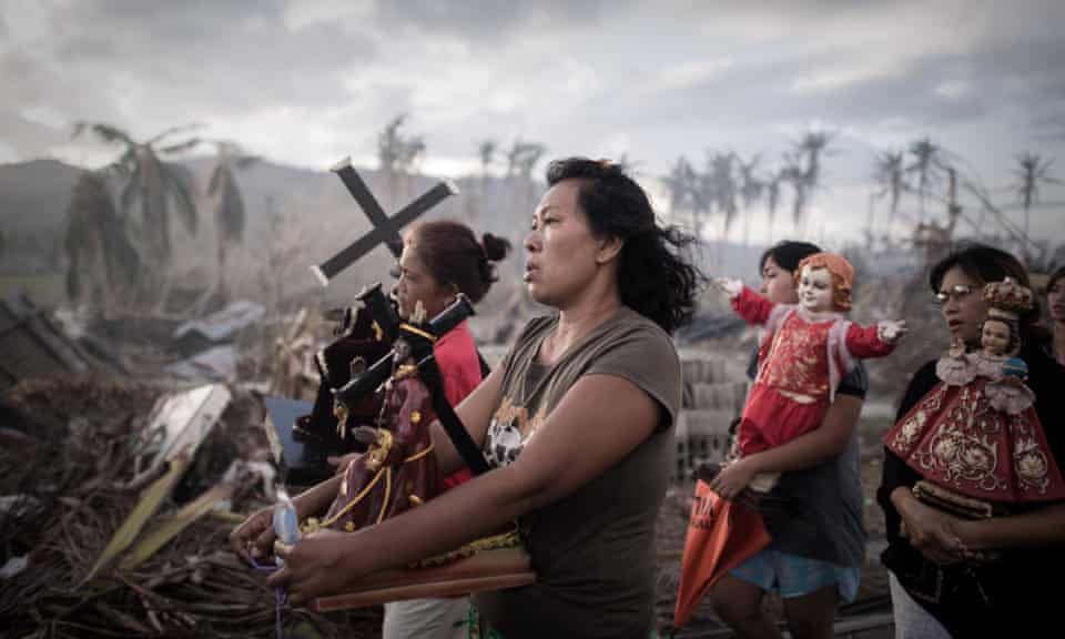 Survivors of Super Typhoon Haiyan during a religious procession in the Philippines. November 2013.