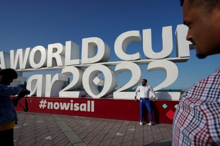 A man posing at a World Cup sign, pictured in March 2023.