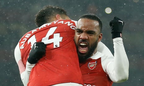 FBL-ENG-PR-ARSENAL-CARDIFF<br>Arsenal's Gabonese striker Pierre-Emerick Aubameyang (L) celebrates with Arsenal's French striker Alexandre Lacazette (R) after scoring from the penalty spot during the English Premier League football match between Arsenal and Cardiff City at the Emirates Stadium in London on January 29, 2019. (Photo by Ian KINGTON / AFP) / RESTRICTED TO EDITORIAL USE. No use with unauthorized audio, video, data, fixture lists, club/league logos or 'live' services. Online in-match use limited to 120 images. An additional 40 images may be used in extra time. No video emulation. Social media in-match use limited to 120 images. An additional 40 images may be used in extra time. No use in betting publications, games or single club/league/player publications. / IAN KINGTON/AFP/Getty Images