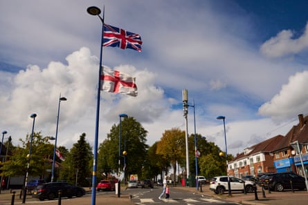 Flags on lamp-posts in Weoley Castle in Birmingham.
