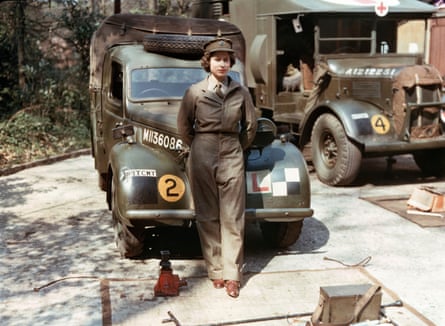 The princess stands in front of an army vehicle