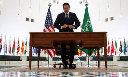 Marco Rubio, the US secretary of state, looks on as he adjusts his suit after arriving at Riyadh office.