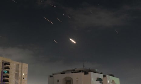 Flares in the sky over Tel Aviv as Israel’s defence system intercepts missiles and drones from Iran