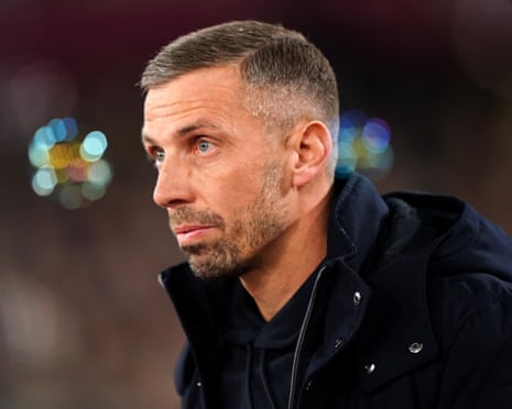 Gary O’Neil in a black coat.