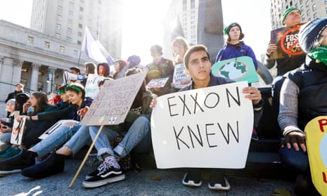 A group of climate activists rally across from a courthouse where ExxonMobile was sued by the New York attorney general, November 2019.