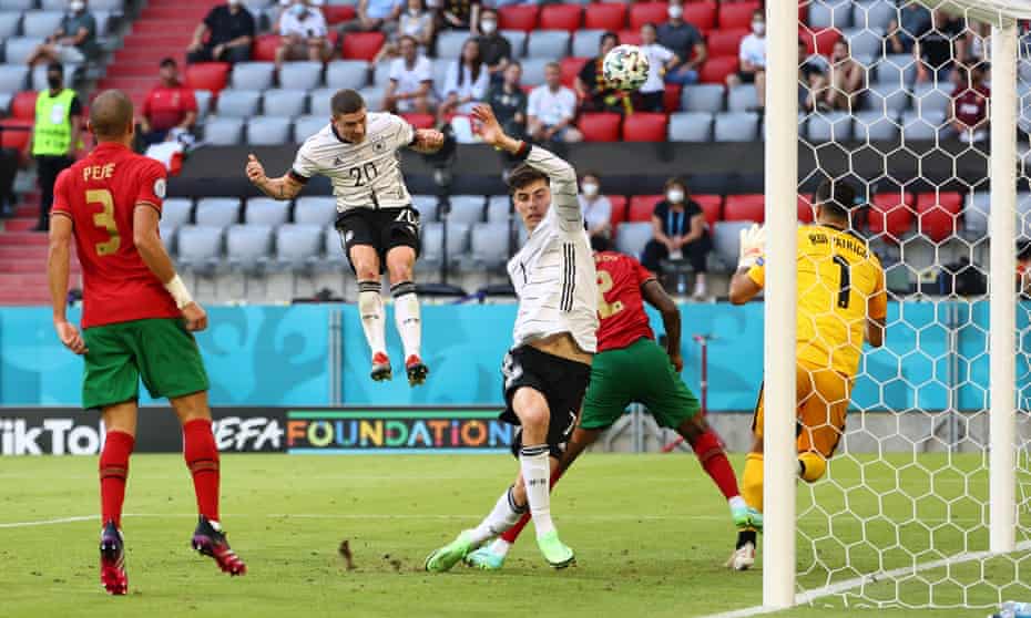 Robin Gosens thumps a header past Portugal goalkeeper Rui Patrício.