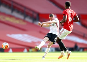 John Lundstram (L) of Sheffield United has a pop from distance.