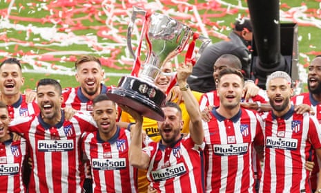 Atlético Madrid players celebrate winning the La Liga match Champions Trophy.