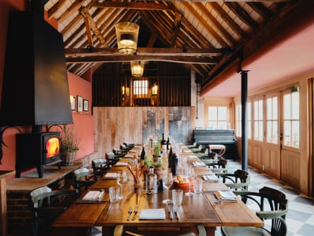 Long dining room with beamed ceiling at Swan Inn, Fittleworth, West Sussex