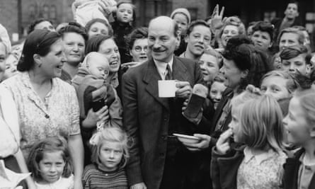 Clement Attlee chatting to campaigning in his Limehouse constituency on 5th July 1945 on his way to a landslide victory in the general election.