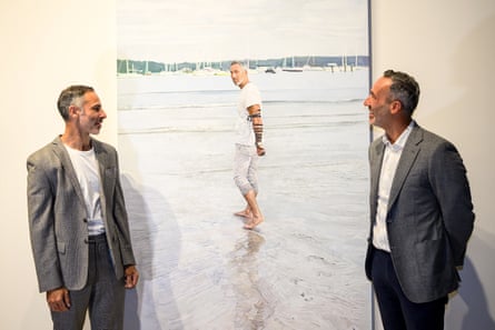 Artist Michael Zavros and Alex Ryvchin pose with the portrait