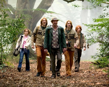 actors walk through woodland