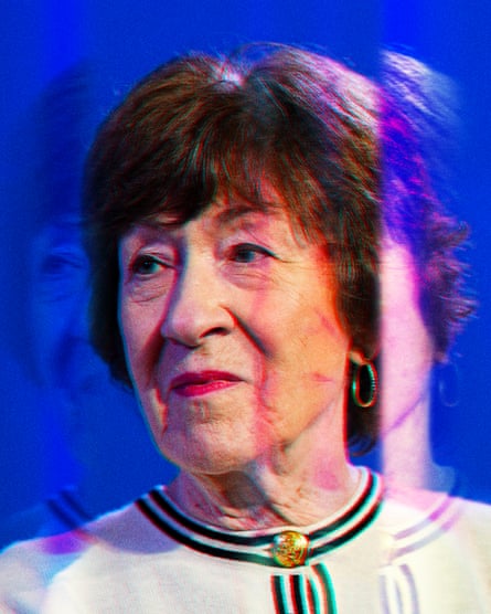 A woman in a formal top looking to the side, against a blue background,with the colors saturated.
