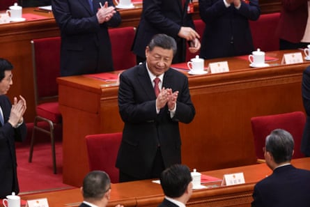 Chinese President Xi Jinping claps at the end of the closing meeting of the second session of the 14th National People’s Congress (NPC) at the Great Hall of the People in Beijing on Monday.