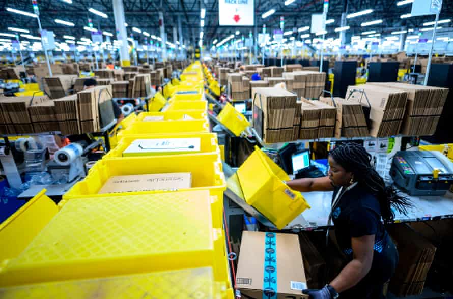 A woman works at a packing station at the Amazon fulfillment center in Staten Island on 5 February 2019.