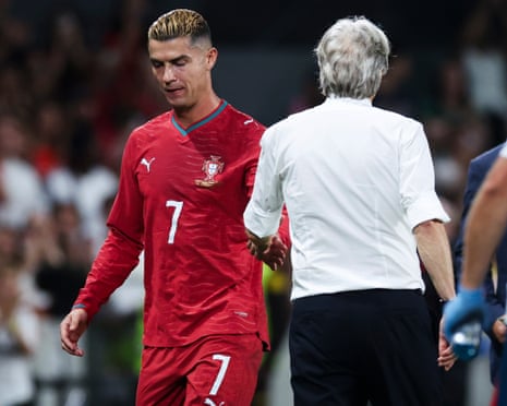 Cristiano Ronaldo shakes hands with head coach Jorge Jesus after being subbed off against Wales