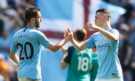 Bernardo Silva and Phil Foden celebrate at the final whistle.