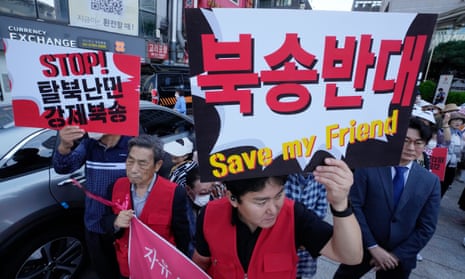 North Korean defectors and human right activists stage a rally in Seoul demanding Beijing release  defectors captured in China