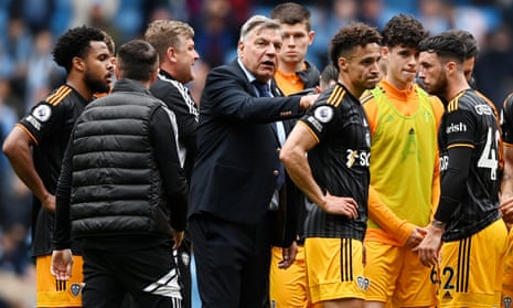 Sam Allardyce consoles his Leeds players after the 2-1 defeat by Manchester City