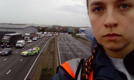 A protester who climbed a gantry on the M25 between junctions six and seven in Surrey on Monday.