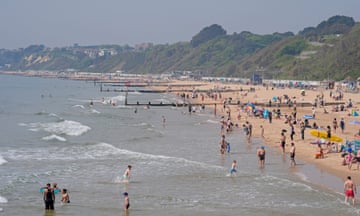 A wide view of the beach and sea