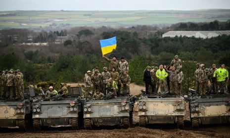 Ukrainian recruits and their British trainers at a military facility in southern England