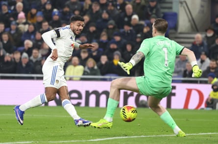 Leeds’s James Justin slots home the opening goal of the game past Everton’s Jordan Pickford.