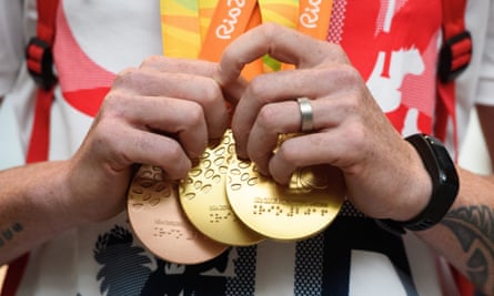 A Paralympian clutching medals