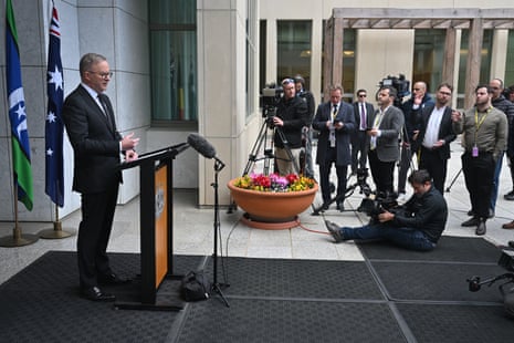Anthony Albanese speaking at a press conference outside Parliament House. Reporters and camera operators are standing watching