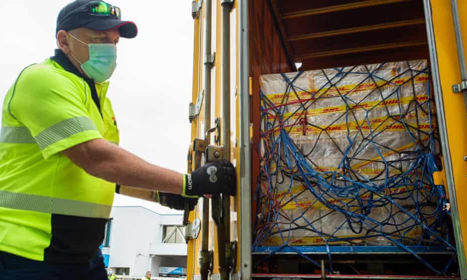 Australia’s first shipment of the Pfizer coronavirus vaccine is loaded on to a truck after landing at Sydney airport on Monday