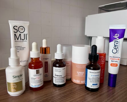 Group shot of vitamin C serums featured in this group test on a wooden surface.